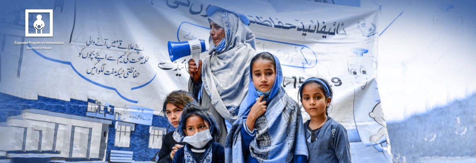 Blue and white background with 4 little pakistani girls dressed in blue school uniform and a female teacher behind them with holding a speaker.